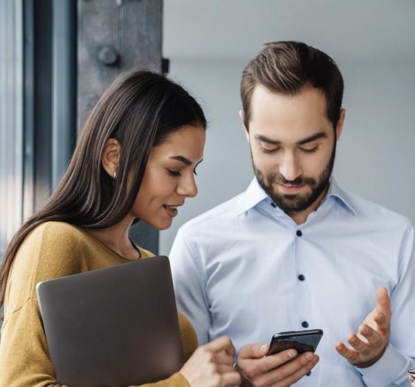 Man and woman looking at phone